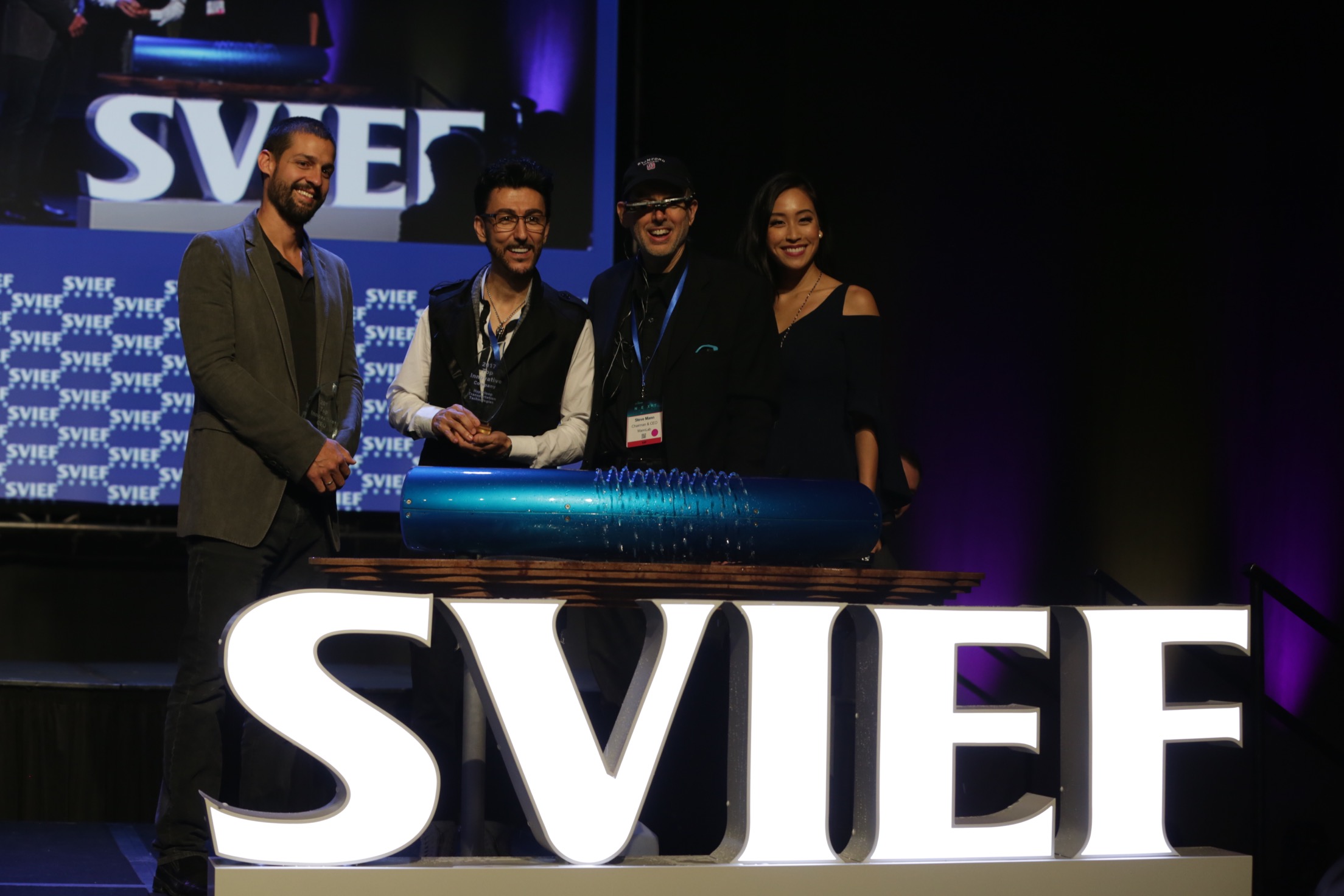HyperloopTT team at SVIEF with Hyperloop capsule model