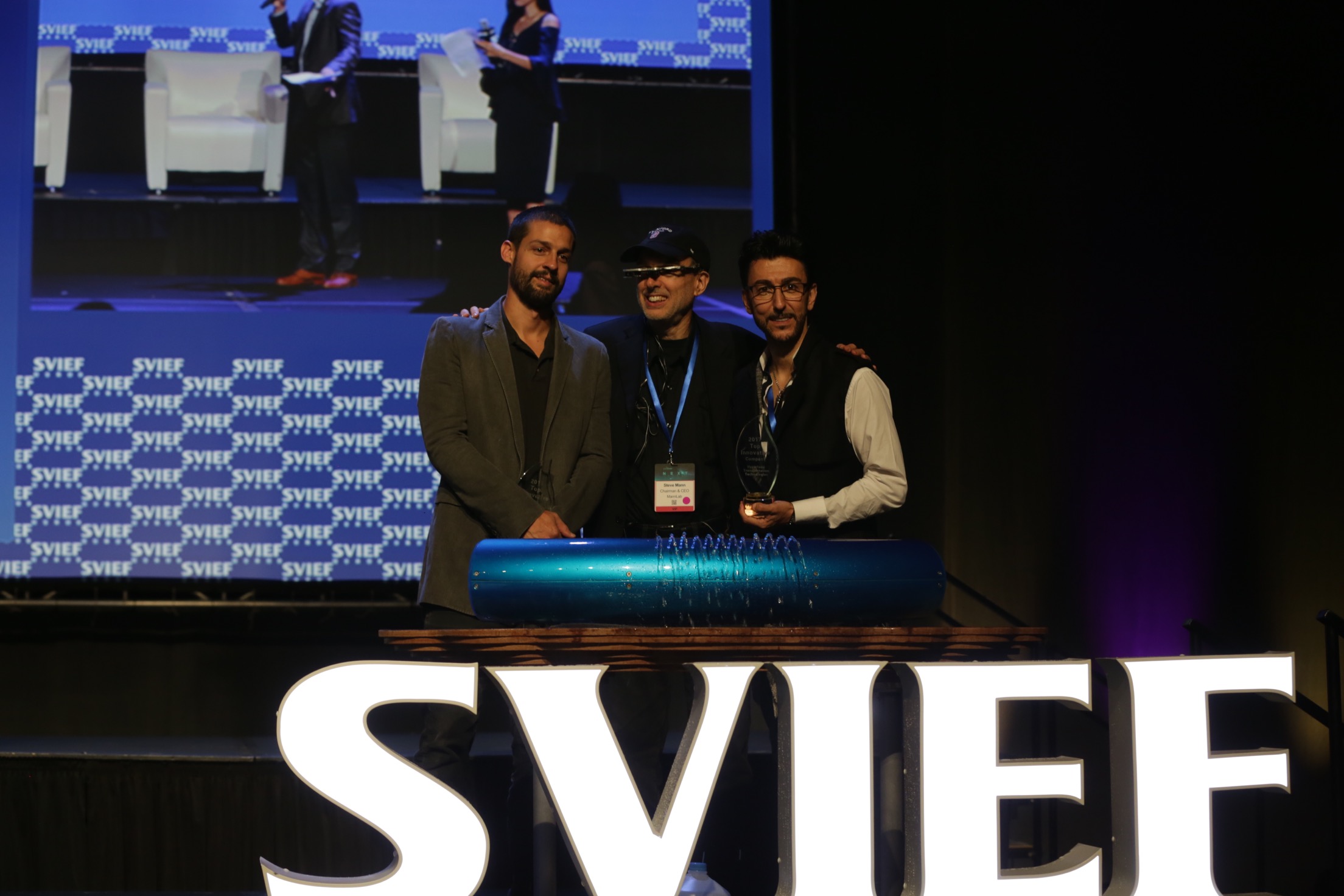 Bibop Gresta with team receiving SVIEF award